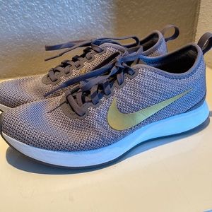 Gray Nike w/gold swoosh. Like new. Wore 1x and realized the were not my size.
